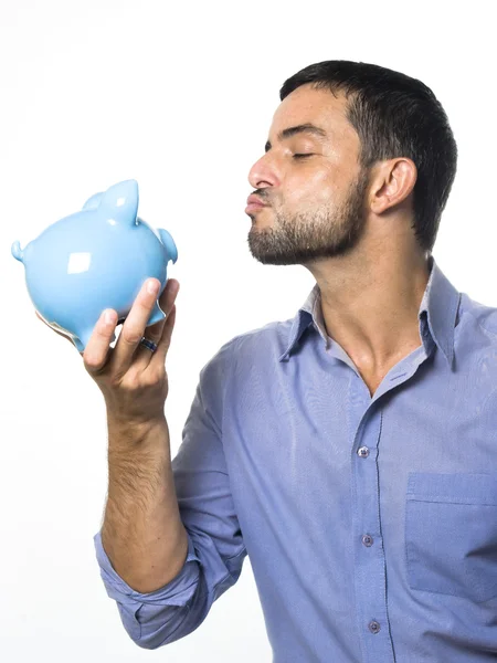 Young Man kissing Piggy bank — Stock Photo, Image