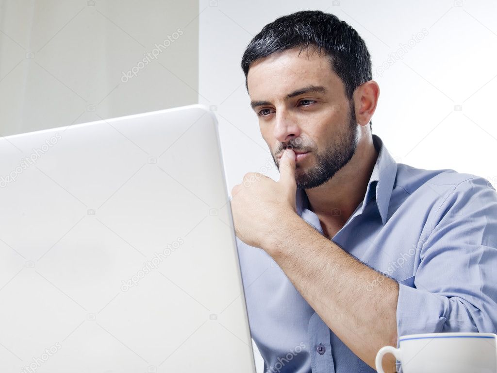 Young Man with Beard working on Laptop