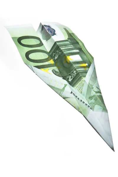 Ruka držící bankovky papírové letadlo — Stock fotografie
