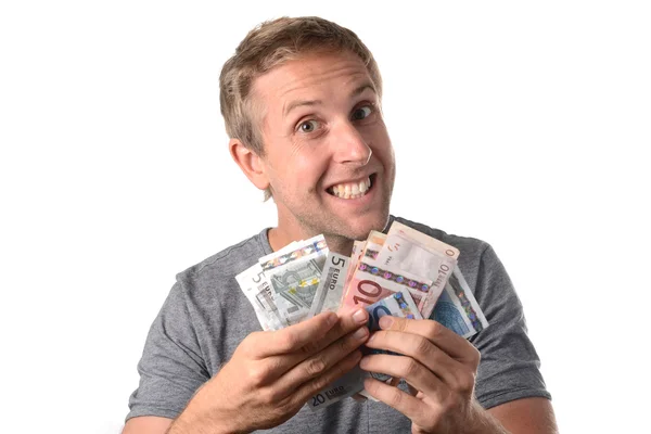 Счастливый человек, держащий банкноты — стоковое фото