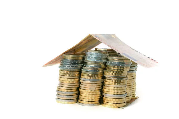 Euro Coins pile House with banknote roof Stock Photo