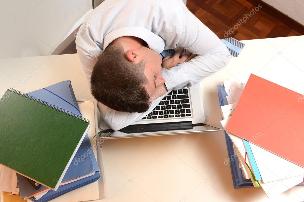 Stressed and Overworked Businessman sleeping