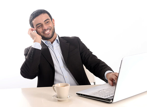 relaxed businessman working with computer and mobile