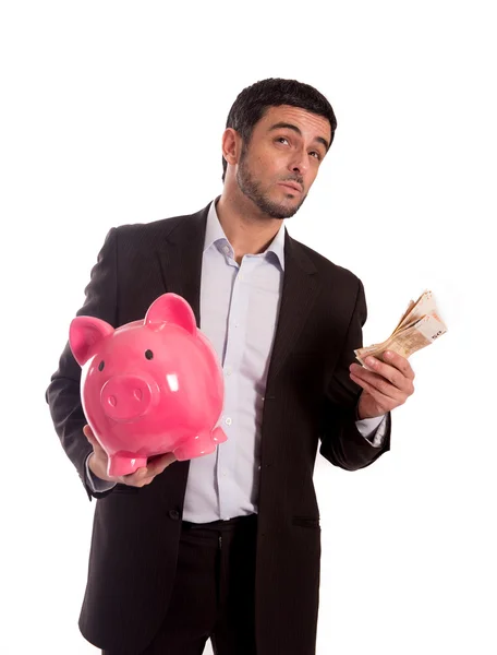 Бизнесмен держит банк с деньгами — стоковое фото