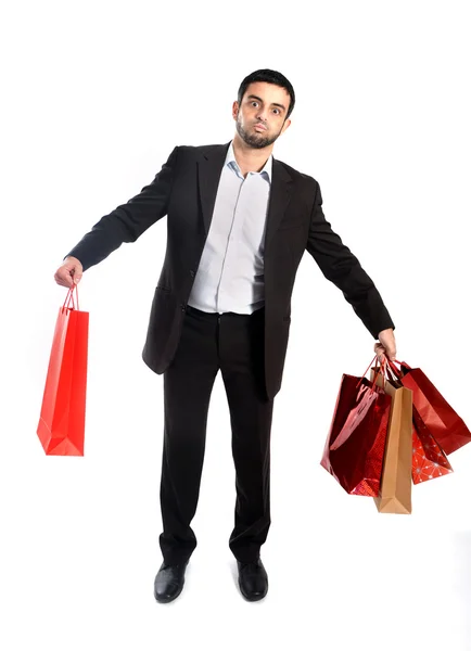 Hombre llevando venta bolsas de compras en el estrés — Foto de Stock