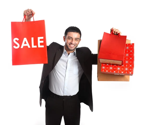 Homem carregando sacos de compras venda vermelha — Fotografia de Stock