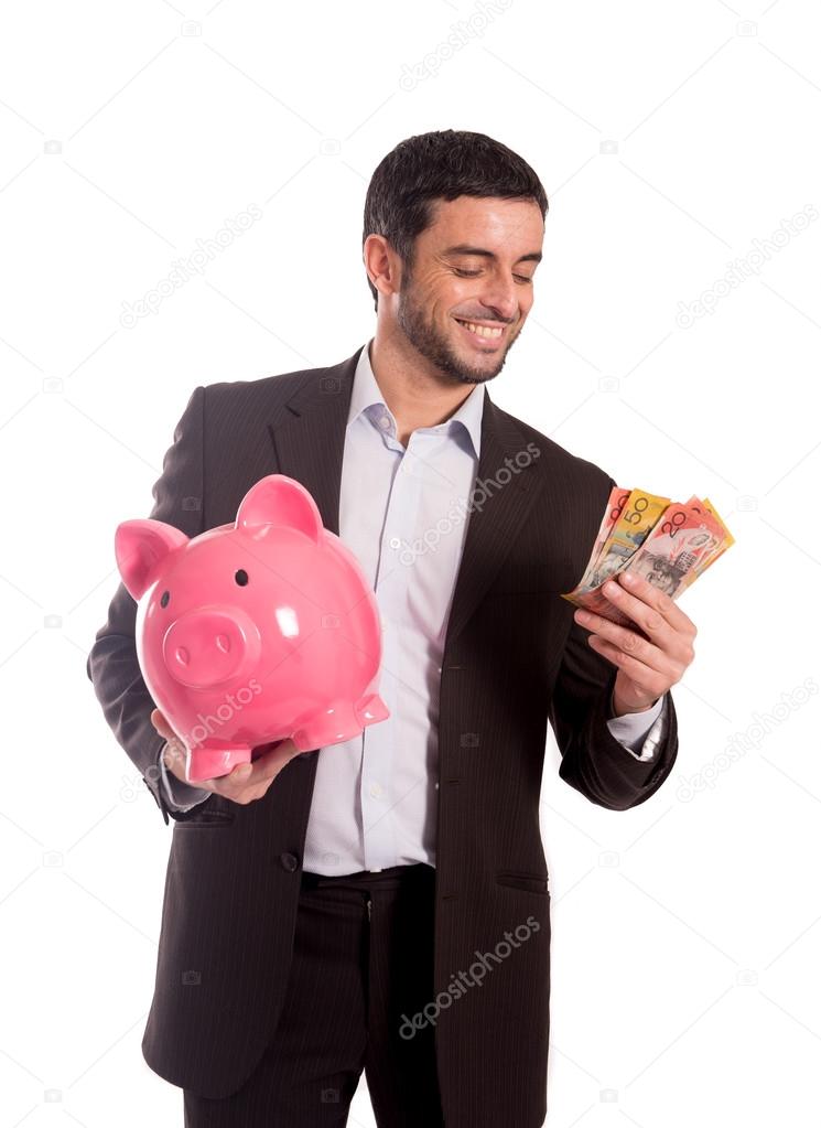 happy business man holding piggy bank with Australian Dollars