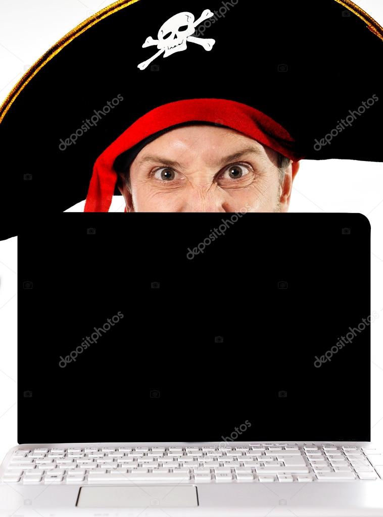 Young man in pirate costume and Computer