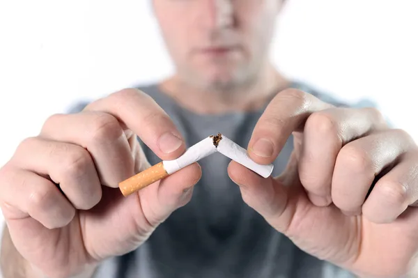 Attractive young man in Quit smoking resolution — Stock Photo, Image