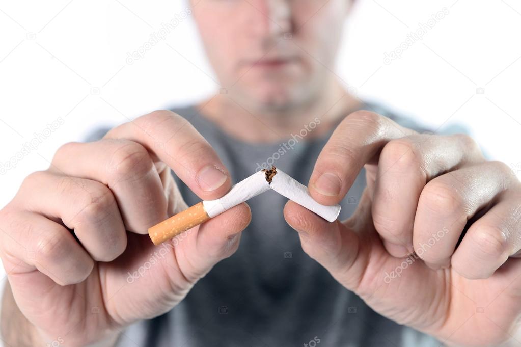 Attractive young man in Quit smoking resolution