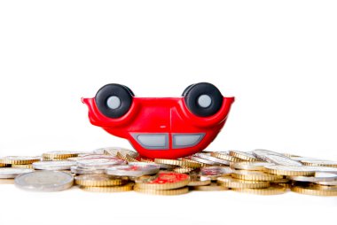red toy car up side down on euro coins clipart