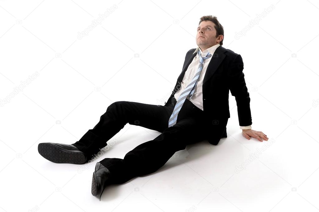 Young Business Man in Stress on the floor