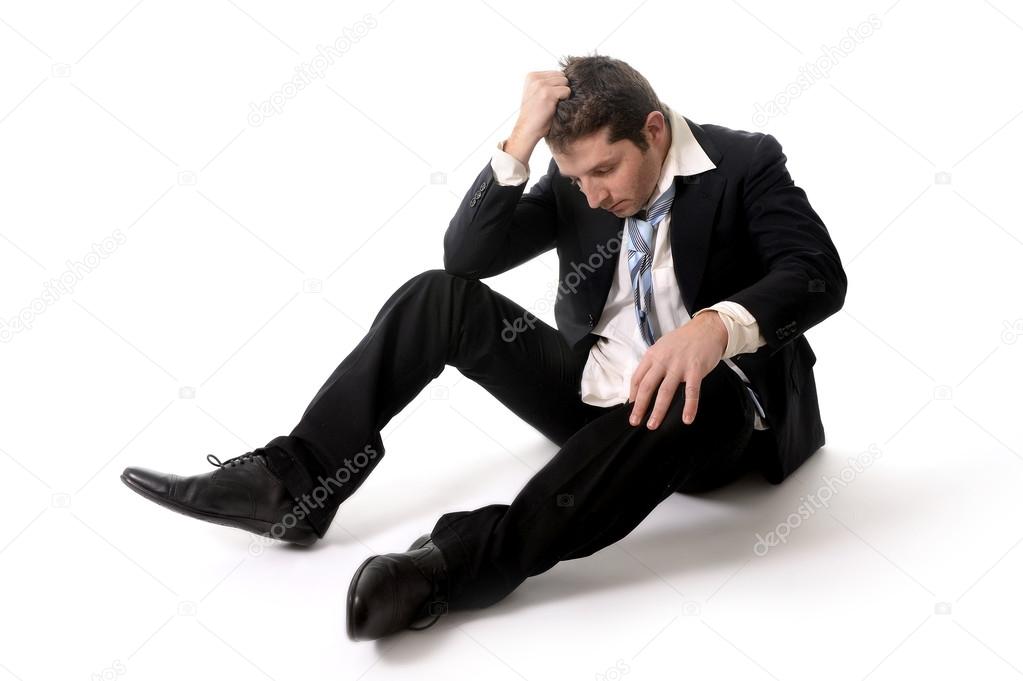 Young Business Man in Stress on the floor