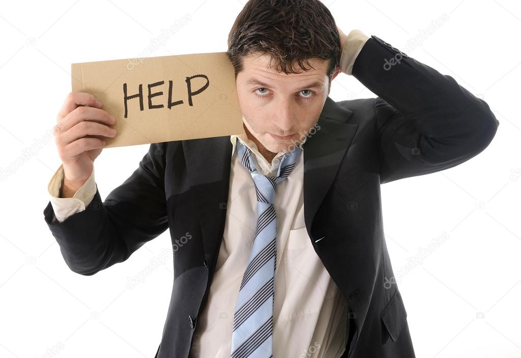 stressed business man holding help sign