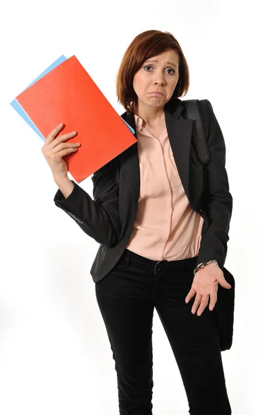 Doubtful business woman or student with portfolio standing and thinking — Stock Photo, Image