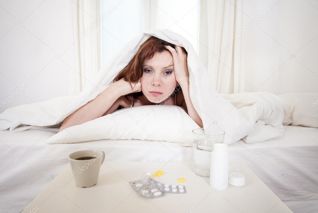 red haired girl with hangover wanting coffee in bed