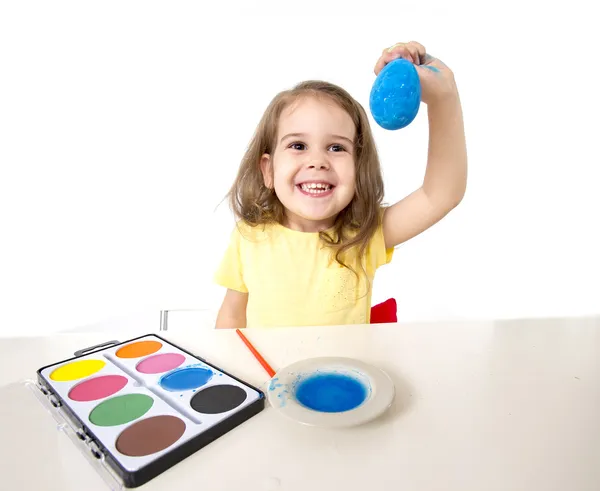 Little girl painting dyed egg for Easter celebration — Stock Photo, Image