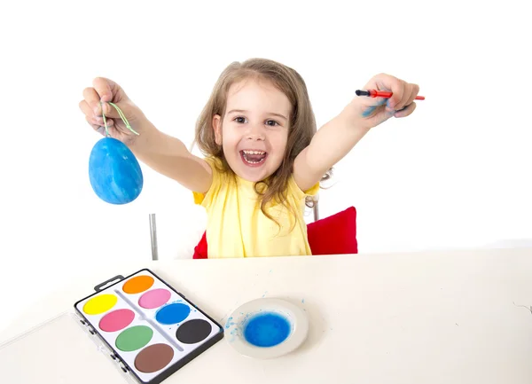 Little girl painting dyed egg for Easter celebration — Stock Photo, Image