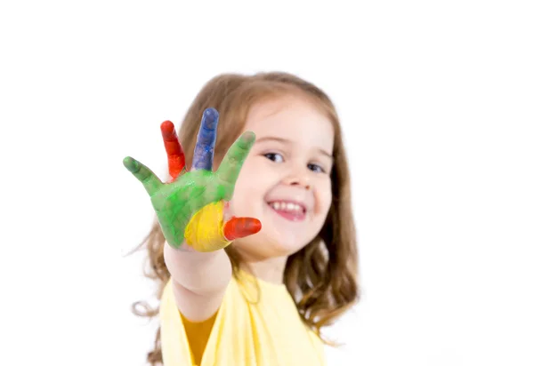 Gelukkig meisje met handen geschilderd in levendige kleuren — Stockfoto