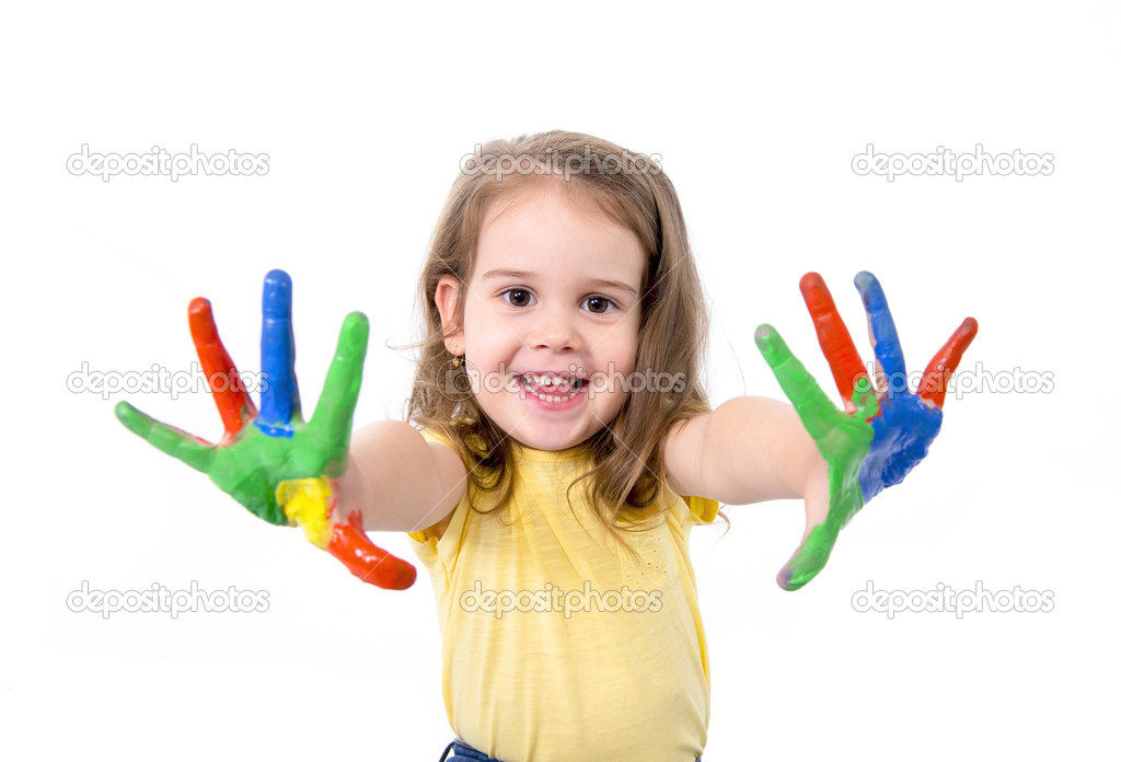 Happy little girl with hands painted in vivid colours