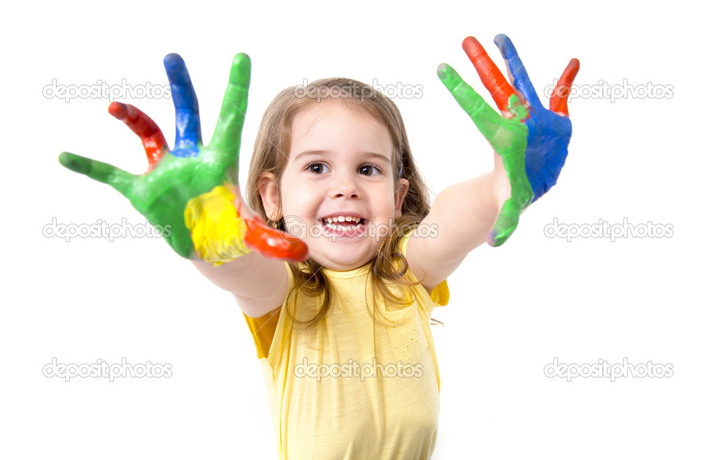 Happy little girl with hands painted in vivid colours