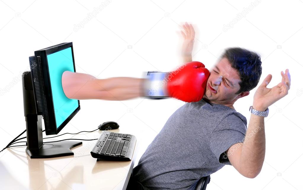 man with computer hit by boxing glove social media cyber mobbing