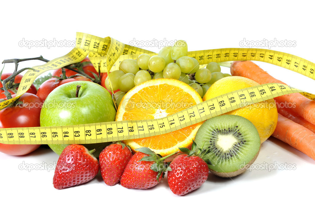 mix of fresh fruit and vegetables wrapped in yellow measure tape