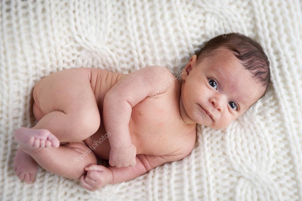 Light skin newborn baby boy Cute newborn baby boy on white blanket