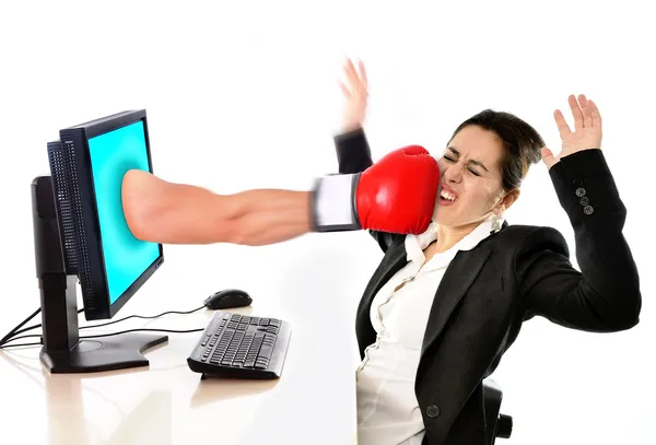 Woman with computer hit by boxing glove social media cyber mobbing — Stock Photo, Image