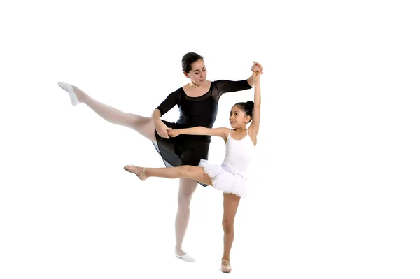 young little girl ballerina learning dance lesson with ballet teacher