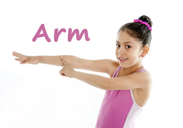 Learning english for children school card of girl pointing at her arm and elbow on white background — Stock Photo, Image