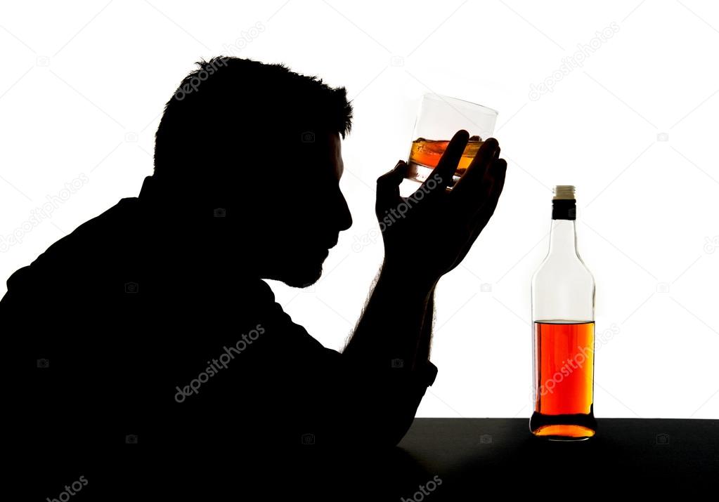 Silhouette of alcoholic drunk man holding whiskey bottle against forehead feeling depressed suffering alcohol addiction and alcoholism problem isolated on White background