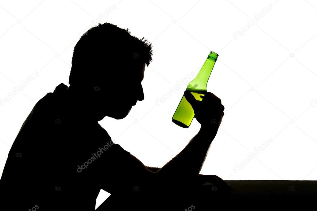 silhouette of alcoholic drunk man drinking beer bottle feeling depressed falling into addiction problem