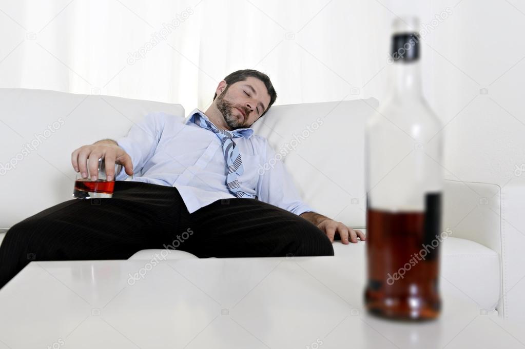 drunk business man wasted and whiskey bottle in alcoholism