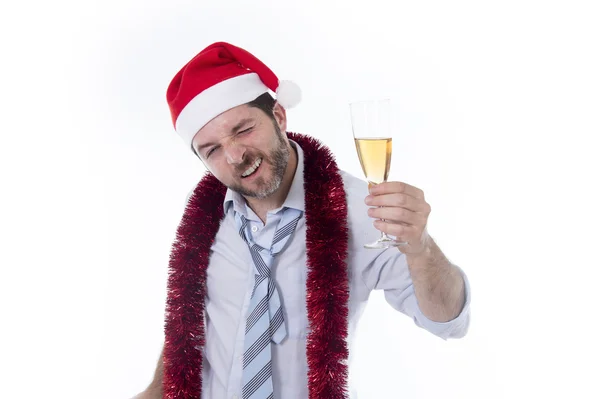 Drunk businessman drinking champagne wearing a santa hat on whit — Stock Photo, Image