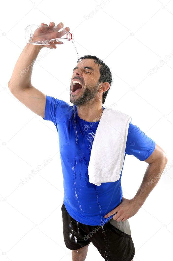 Young attractive and athletic sport man exhausted pouring water on his face