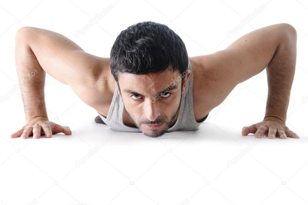 Attractive sport man training push up exercise isolated on white
