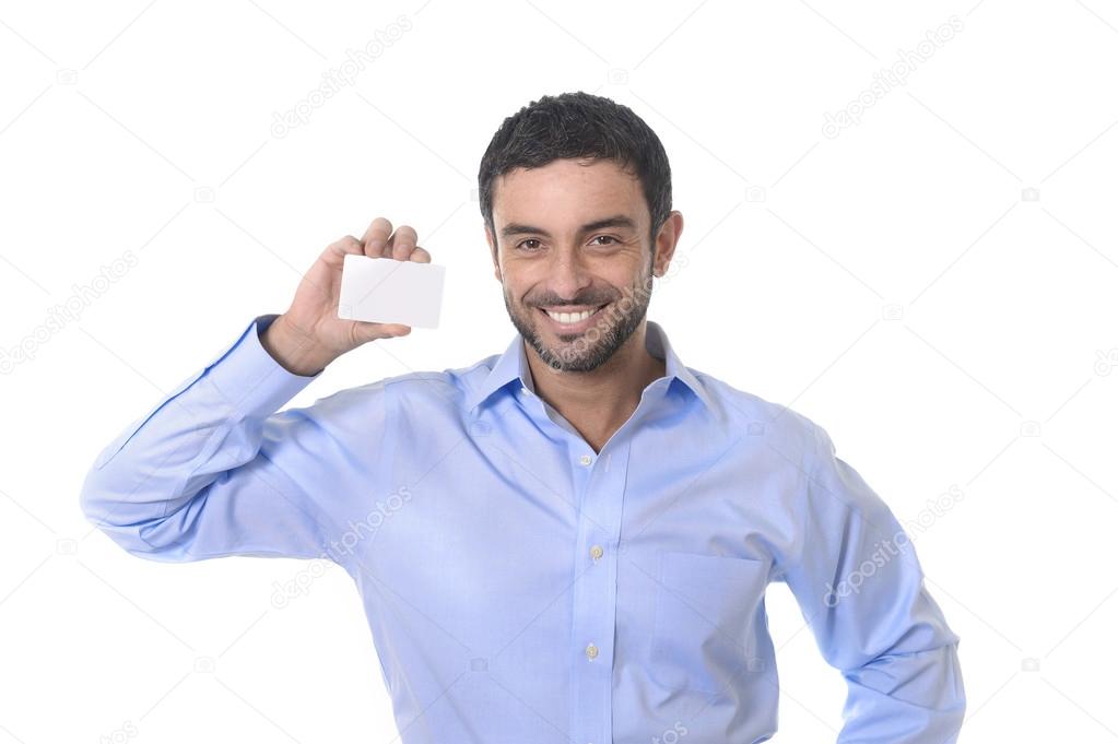 Happy young attractive businessman holding blank business card for adding corporate text company name or logo using empty card as copy space isolated on white blackground