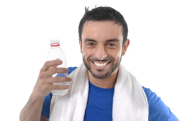 Happy sport man posing corporate with water and towel for fitness center — Stock Photo, Image
