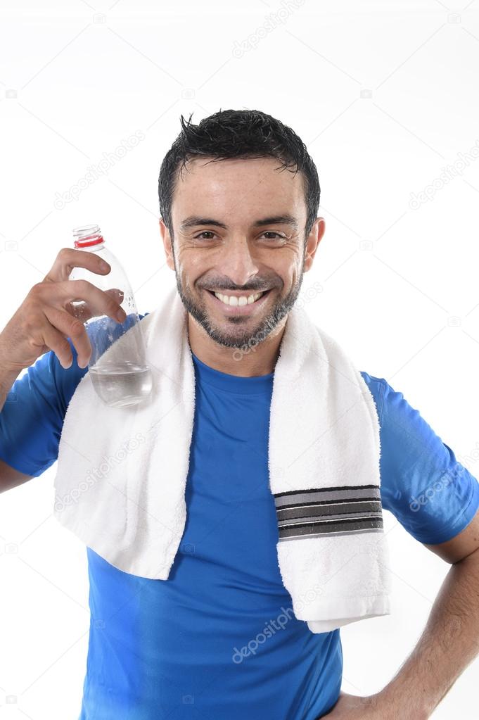 happy sport man posing corporate with water and towel for fitness center