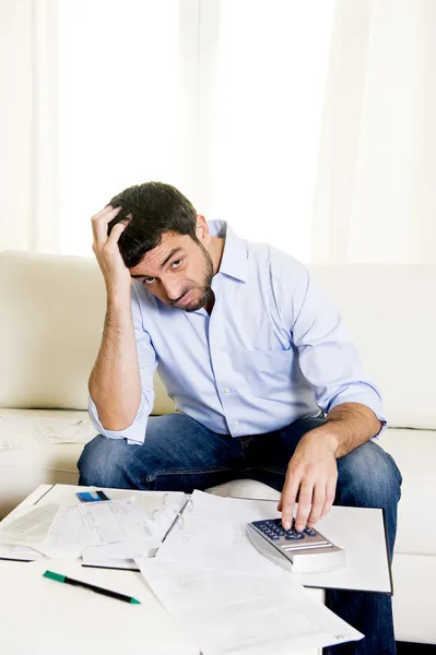 Latin business man worried paying bills on couch — Stock Photo, Image