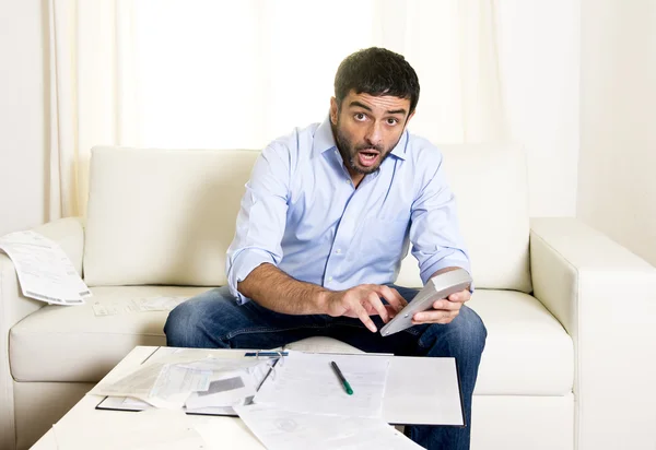 Latin business man worried paying bills on couch — Stock Photo, Image