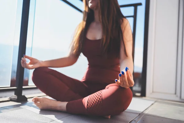 Beautiful Asian smiling fit woman doing yoga on sunny balcony in sport suit. Young happy lady on terrace at summertime. Big city view. Sports exercises and gymnastics, healthy way of life concept. — Stock Photo, Image