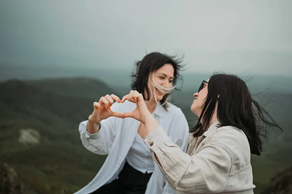 Young Beautiful Happy Lesbian Couple Posing Cloudy Mountains Showing Love — Stock Fotó