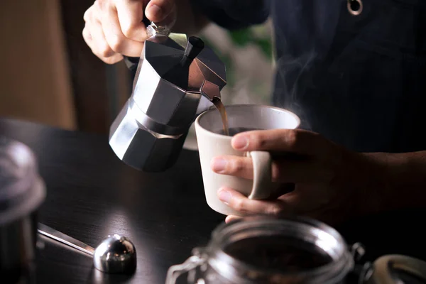 Moka pot pouring coffee. — Stock Photo, Image