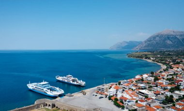 Aerial view of Antirrio city with harbour and two big ferries