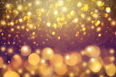 Altın bokeh, yeni yıl arifesinde arka planda bulanık parıltılı ışıklar 