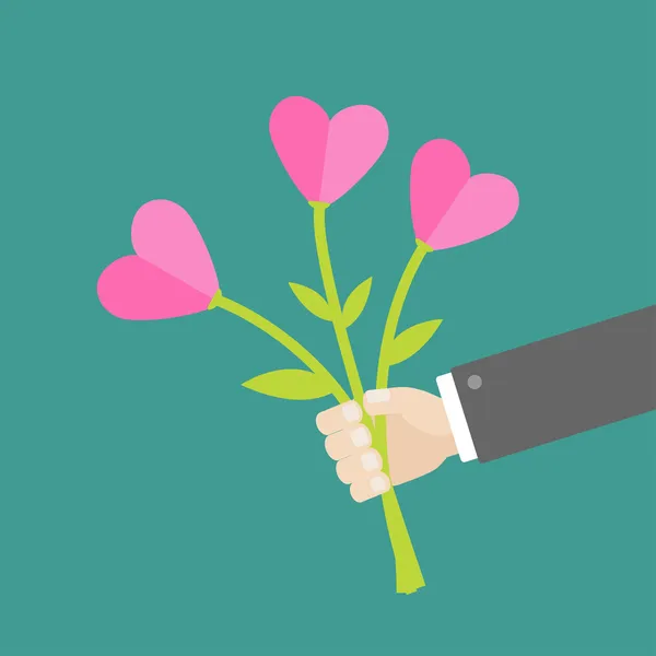 Mano sosteniendo corazones flores . — Vector de stock