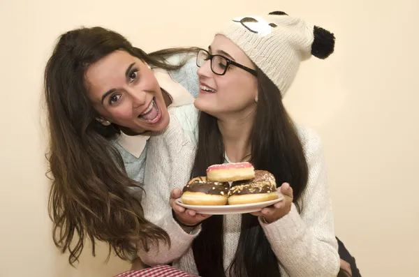 Women with donuts — Stock Photo, Image