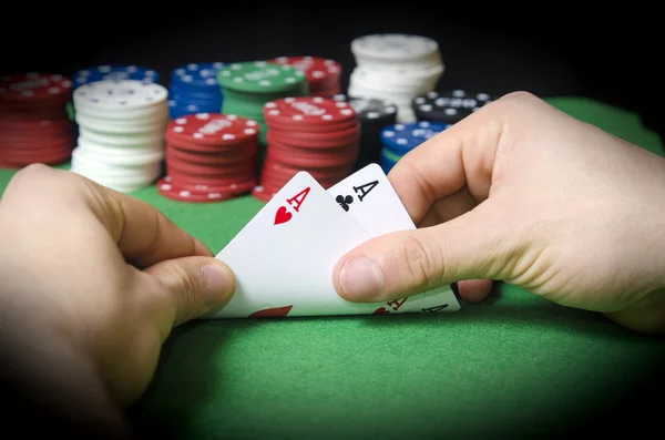 HANDS with pocket aces — Stock Photo, Image